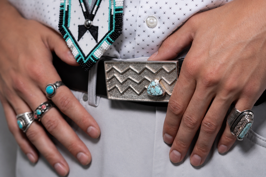 Cuttlebone cast belt buckle with Lone Mountain turquoise